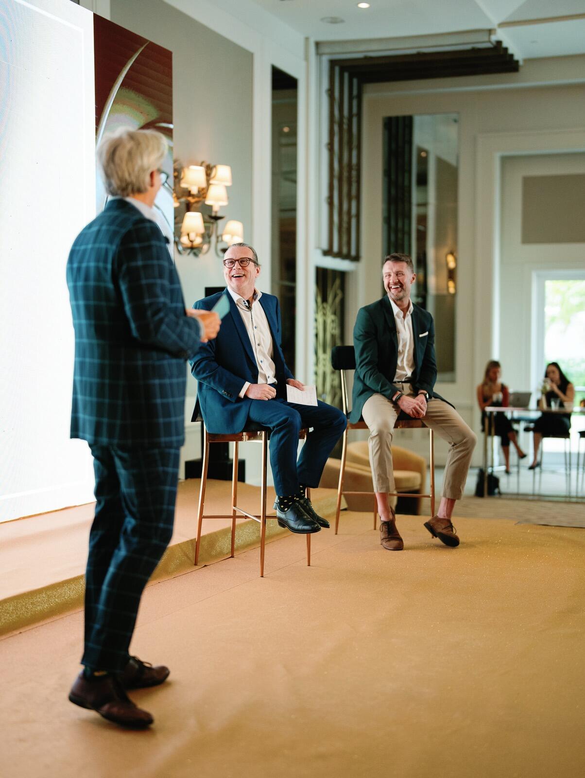 Travis McBurney on stage during panel at RSVP conference