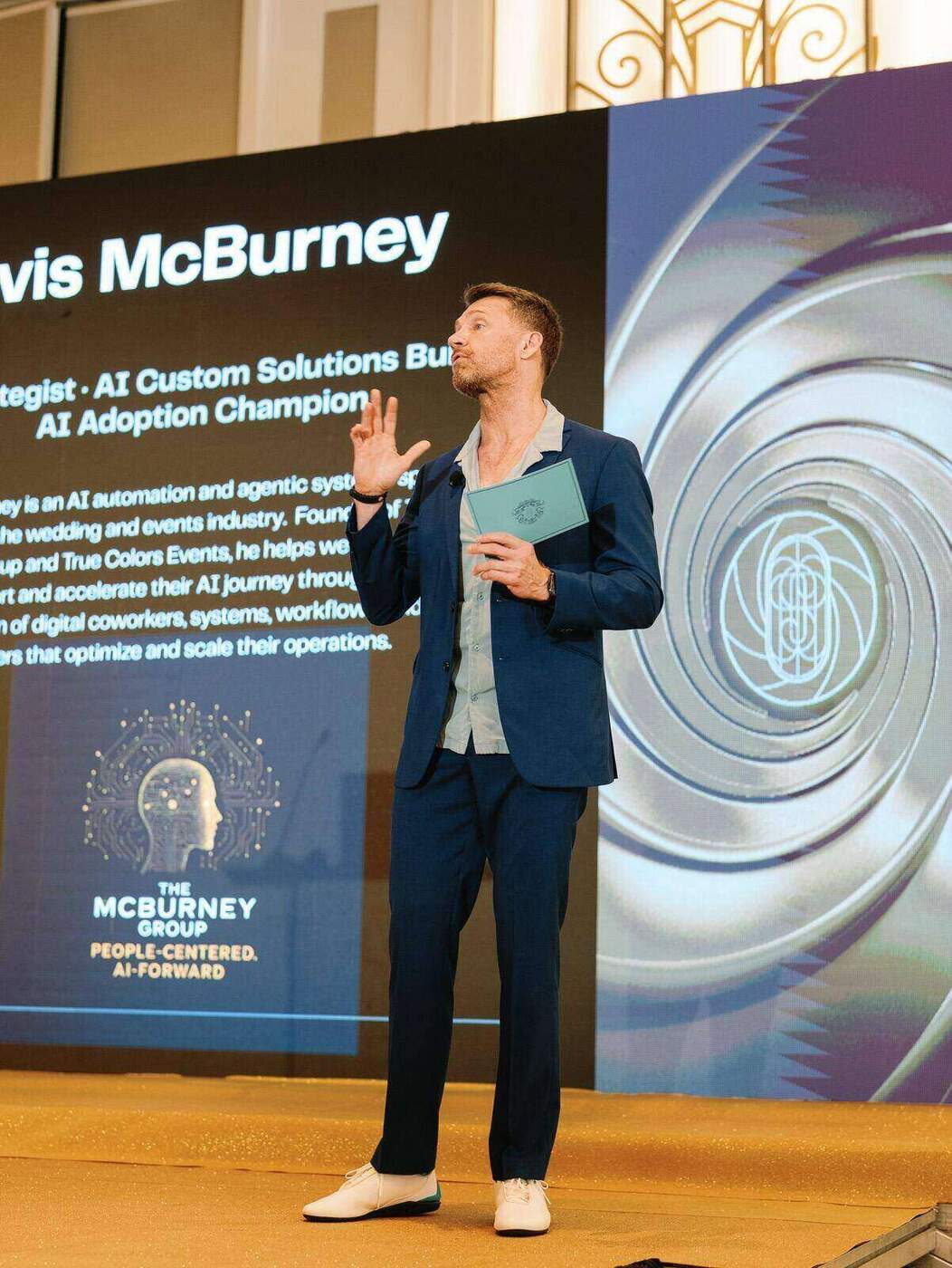 Travis McBurney presenting on stage at RSVP conference
